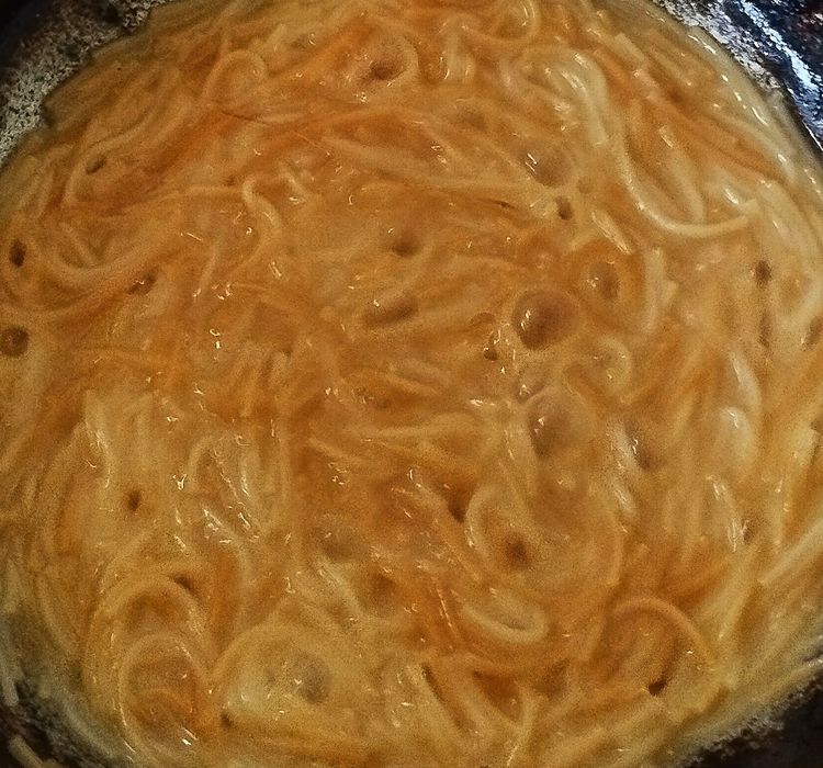 Step 3.1: Cook on medium heat until the vermicelli turns soft and the water is absorbed