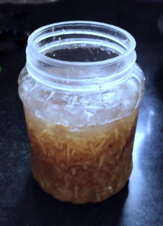Step 1.1: In a clean jar, combine 2 tbsp grated fresh ginger, 2 tbsp sugar, and 2 cups water