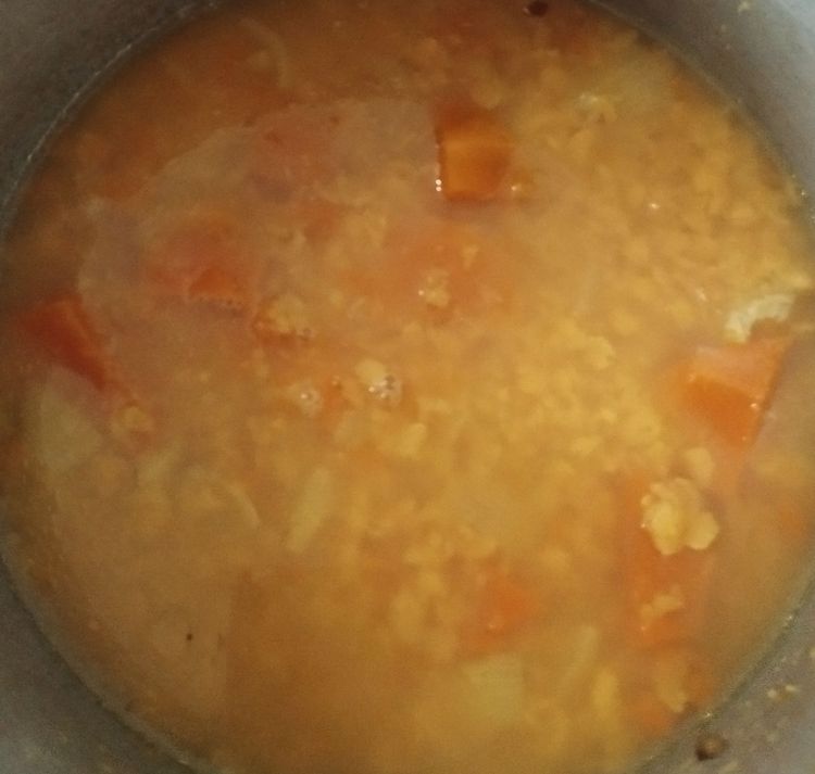 Step 1.1: Pressure cook it with water, turmeric powder, a few drops of oil, and pumpkin pieces for 3–4 whistles or until very soft and mushy