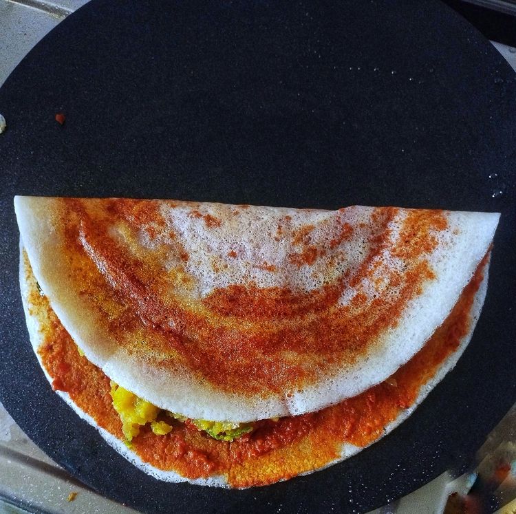 Step 4.1: Fold the dosa and serve hot with coconut chutney and sambar