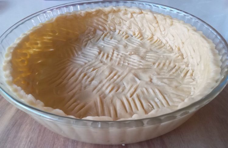 Step 1.1: With your finger press a thin layer of crust mixture in a 27cm tart case