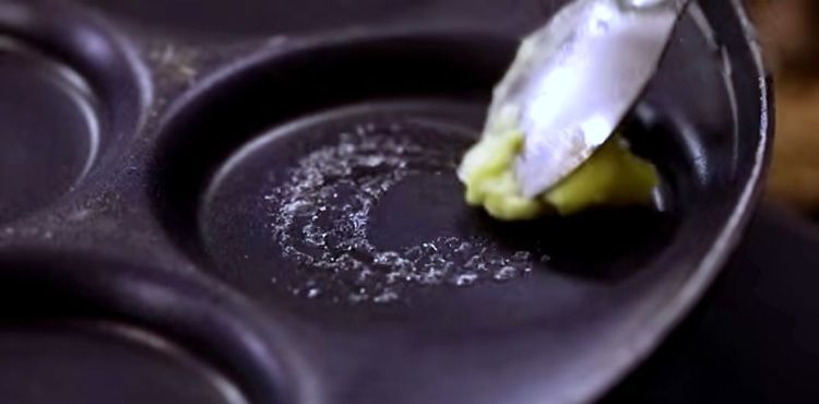 Step 3.2: Heat a pancake tawa and grease it with butter