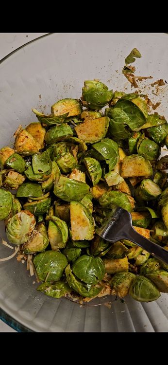 Step 2.1: In a large bowl, toss the Brussels sprouts with olive oil, garlic, smoked paprika, salt, pepper, and chili flakes (if using)
