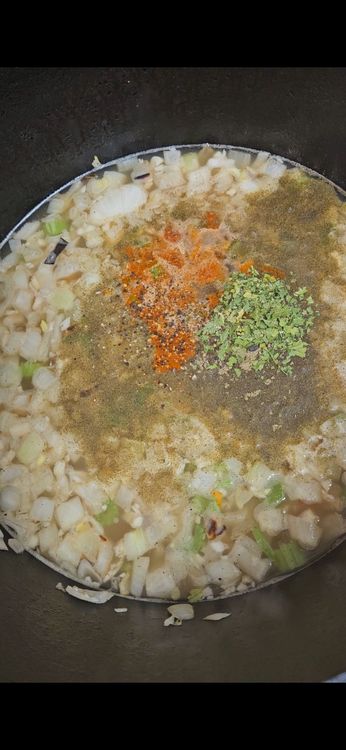 Step 2.1: Stir in the chicken broth, thyme, parsley, paprika, and black pepper