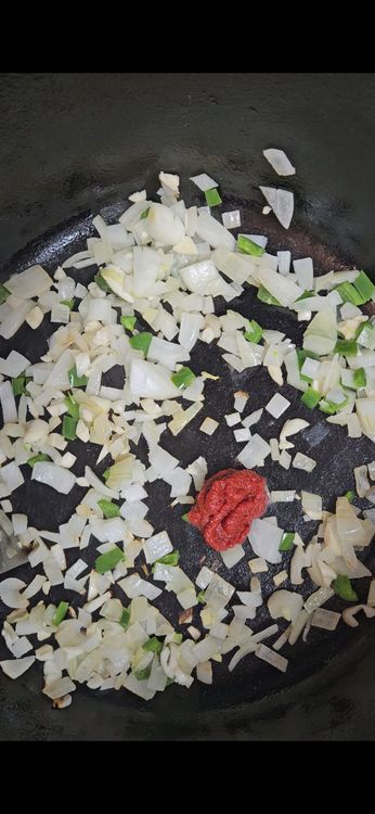 Step 1.1: Add the tomato paste and cook for another minute