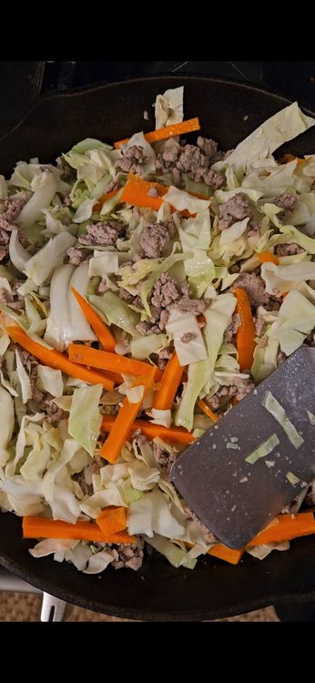 Step 2.1: Stir in the onion, cabbage, and carrots, and cook until the vegetables are tender