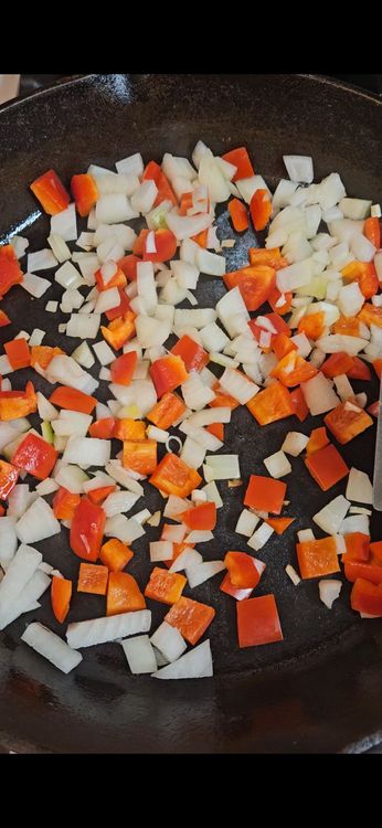 Step 2.1: In a pan, sauté diced bell pepper and onion until softened