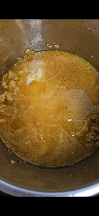 Step 2.1: Add onion, garlic, ginger, red curry paste, curry powder, turmeric, MSG, soy sauce, lime juice, bone broth, and coconut milk to the crockpot