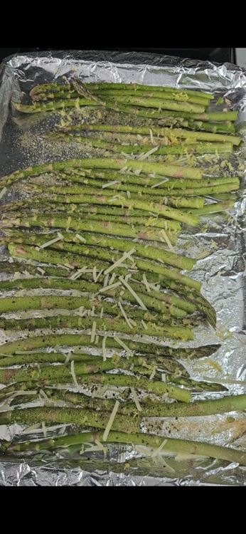 Step 1.3: Add salt, pepper, garlic powder, lemon zest, and Parmesan cheese to the asparagus