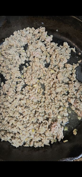 Step 1.1: Add ground chicken, breaking it apart with a spatula