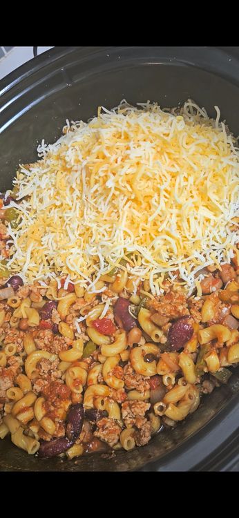 Step 1.1: Once the noodles are cooked, add the cheese and mix well