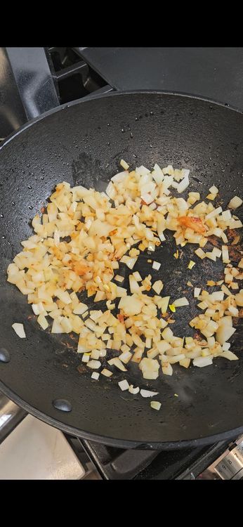 Step 1.1: In the same pan, add chopped onions and sauté until golden brown