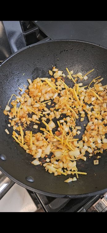 Step 1.1: Stir in minced garlic and grated ginger