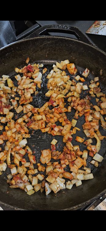 Step 2.1: Add tomato paste and rice to the pan