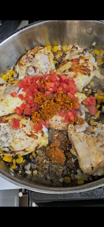 Step 4.1: Stir in the prepared spice paste, tomato paste, and grated tomato