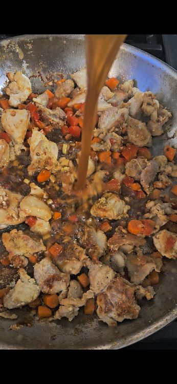 Step 4.1: Pour in the sauce and bring to a simmer
