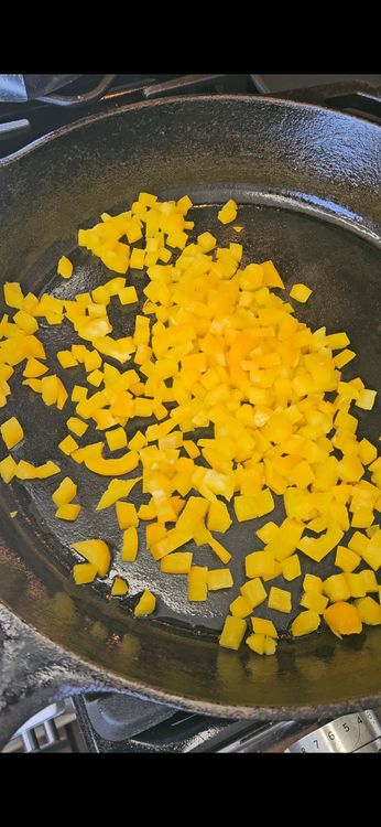 Step 1.1: In a skillet or oven-safe pan over medium heat, add the diced bell pepper and cook for 2-3 minutes