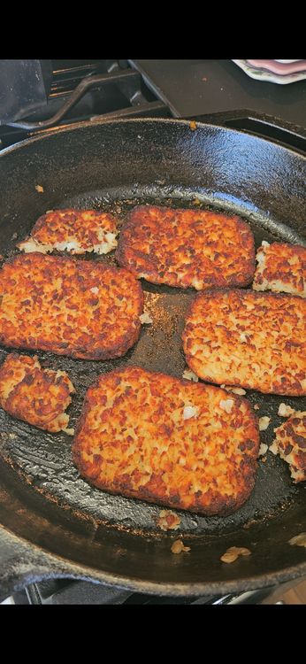 Step 1.1: Layer the hash browns on the bottom of the skillet