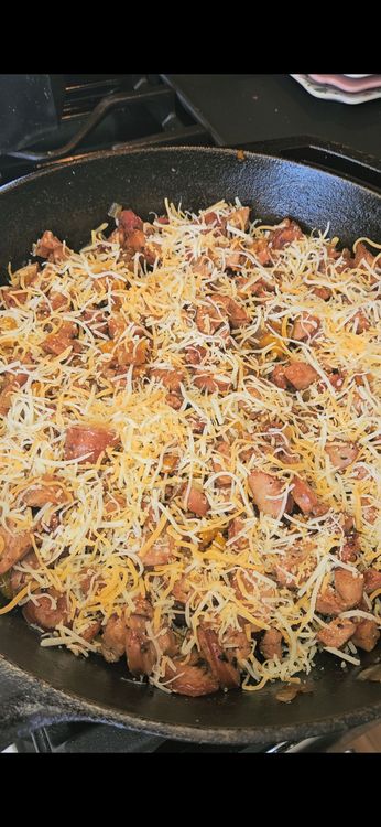 Step 1.1: Evenly sprinkle the shredded cheese over the mixture