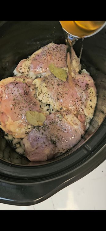 Step 2.1: Pour the wine over the chicken, then add the crushed tomatoes