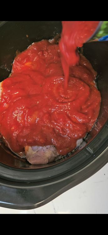 Step 2.2: Pour the wine over the chicken, then add the crushed tomatoes