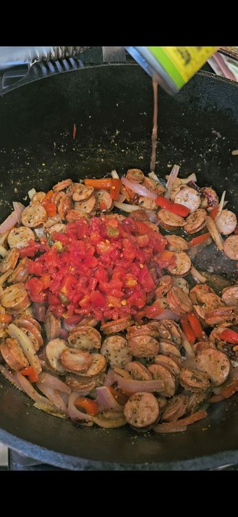 Step 1.2: Stir in the cajun seasoning, diced tomatoes, rice, and chicken bone broth