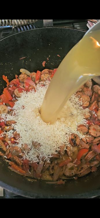 Step 1.4: Stir in the cajun seasoning, diced tomatoes, rice, and chicken bone broth