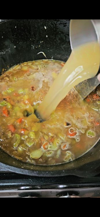 Step 1.1: Gradually pour in the chicken broth, stirring to combine