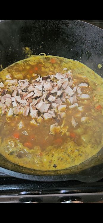 Step 1.1: Stir in the shredded rotisserie chicken and frozen peas