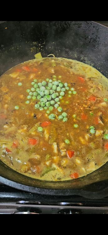 Step 1.2: Stir in the shredded rotisserie chicken and frozen peas