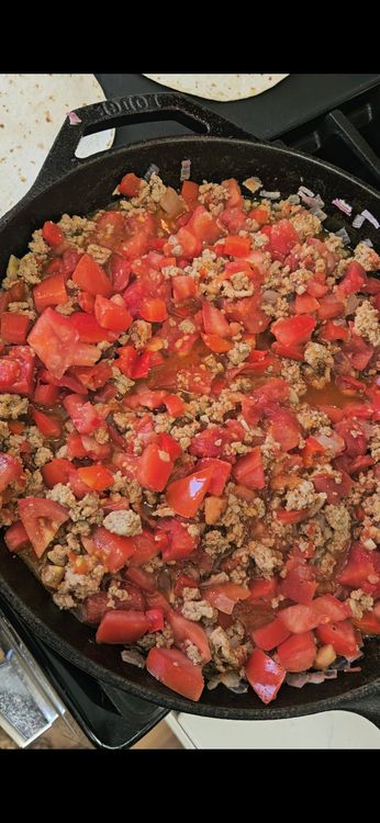 Step 2.1: Add harissa, cumin, and tomatos and mix