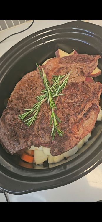 Step 3.1: Lay 1–2 sprigs of fresh rosemary over the roast