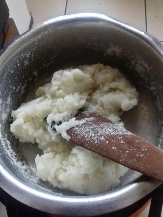 Step 1.1: Reduce heat to medium and keep turning the ugali as it continues to stick together