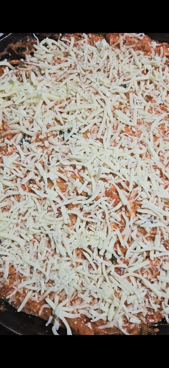 Step 4.1: Top the dish with the remaining shredded mozzarella cheese