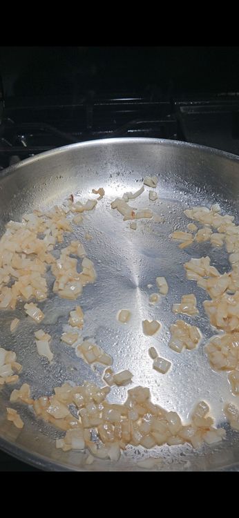 Step 1.2: Add the white wine to the pan and simmer until reduced by half, about 3–5 minutes
