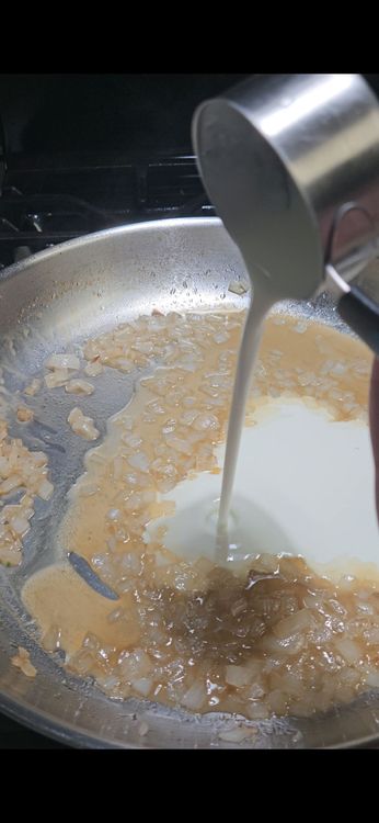 Step 1.1: Reduce the heat to low and stir in the heavy cream