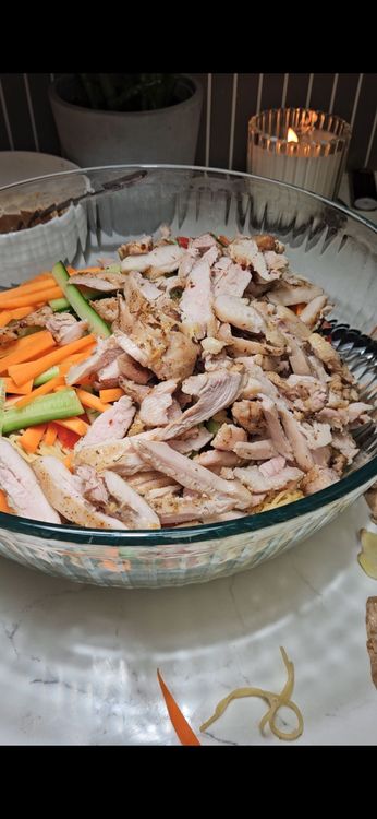 Step 1.1: In a large bowl, toss the cooked noodles with the shredded chicken and vegetables