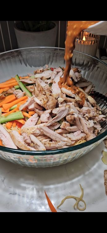 Step 1.1: Pour the prepared dressing over the noodle mixture and toss to coat evenly