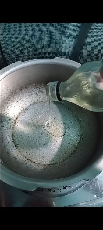 Step 2.2: In a pan, heat oil on medium heat