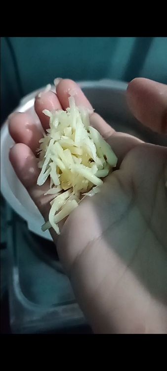 Step 2.3: Add the chopped onion, garlic, and ginger to the pan