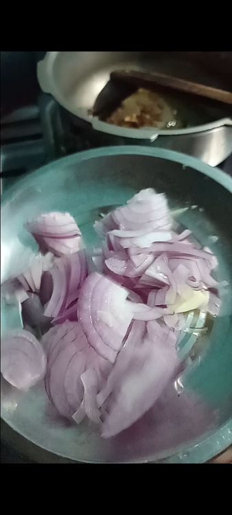 Step 2.1: Add the chopped onion, garlic, and ginger to the pan