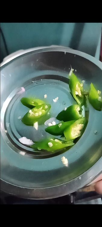Step 2.2: Stir in the curry leaves and green chillies, cooking for another minute