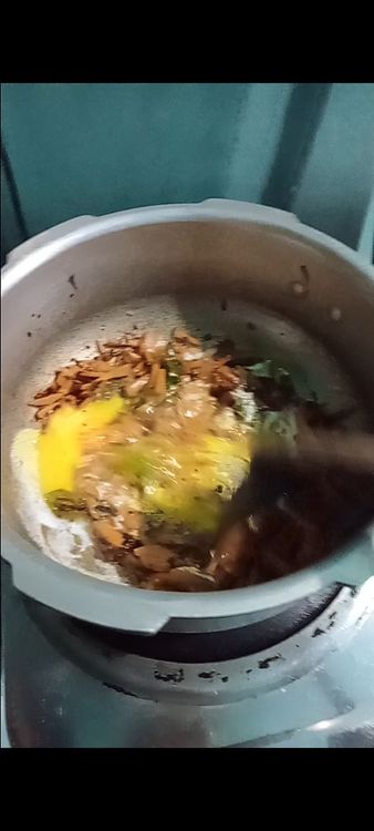 Step 3.4: Push the vegetables to one side of the pan and pour in the beaten eggs on the other side
