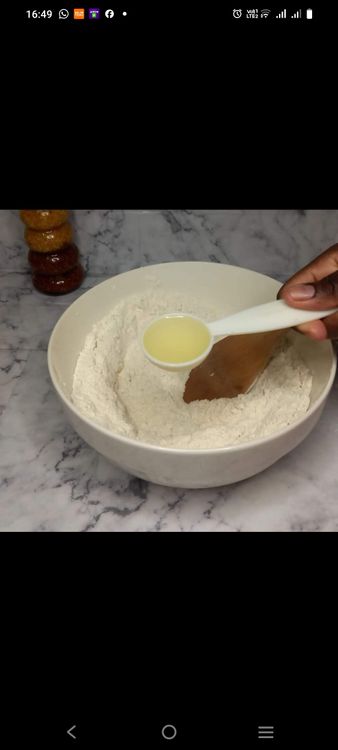 Step 1.1: Add the oil and warm milk to the dry ingredients and mix until a dough forms