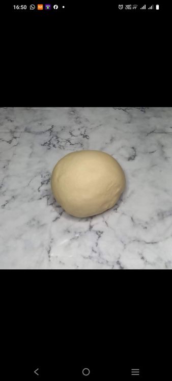 Step 1.1: Knead the dough on a floured surface until smooth and elastic