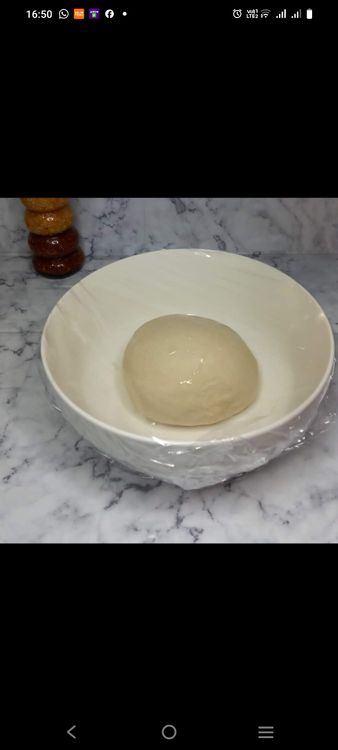 Step 1.1: Place the dough in a greased bowl, cover, and let it rise until doubled in size