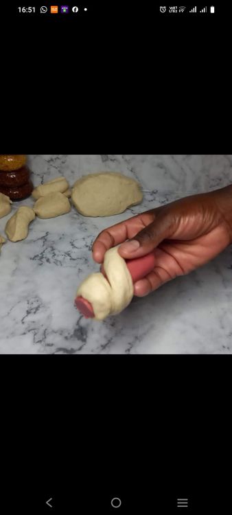 Step 2.1: Roll each piece of dough into a rectangle and wrap it around a vienna sausage