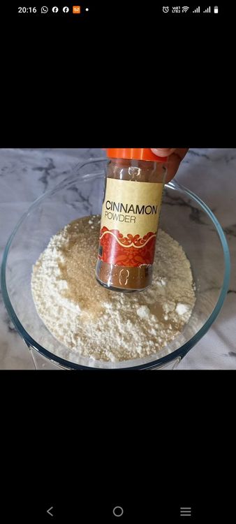 Step 1.2: Add the egg, warm milk, and melted margarine to the dry ingredients and mix until a dough forms