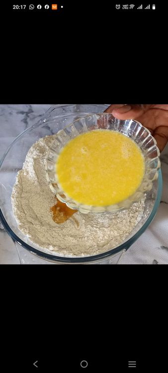 Step 1.1: Add the egg, warm milk, and melted margarine to the dry ingredients and mix until a dough forms