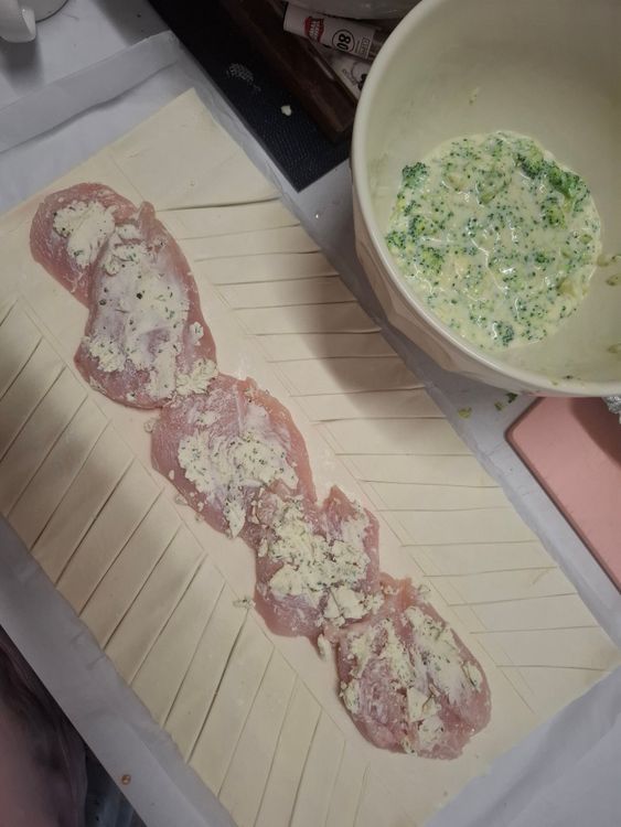 Step 1.1: Place your chicken steaks down the middle, season with salt & pepper ( I like to add a little sprinkle of onion & garlic powder at this point too) and use a knife or spoon to smear them in the garlic and herb boursin cream cheese